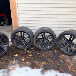 Black 20 inch staggered wheel and tire set